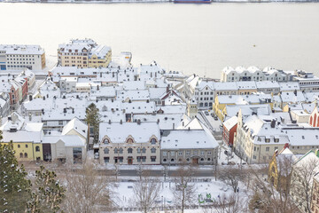 Obraz premium The Jugend city Aalesund (Ålesund) harbor on a beautiful cold winter's day. Møre and Romsdal county