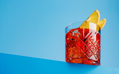 Classic negroni against a cool blue background