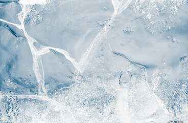 A textured of transparent ice on a blue background.