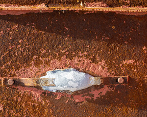 A zinc sacrificial anode on a marine vessel. The anode will dissolve protecting the iron from...