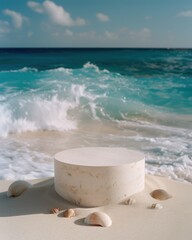 Fototapeta na wymiar A solitary cylindrical pedestal stands on a sandy shore, accompanied by delicate seashells, as turquoise waves gently roll in the background.