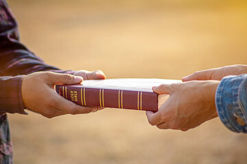 People Share the Bible with their Friends - obrazy, fototapety, plakaty