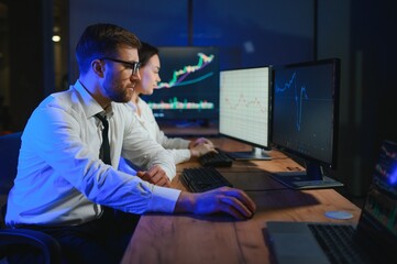 Business team investment working with computer, planning and analyzing graph stock market trading with stock chart data