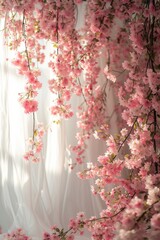 A decorative curtain featuring delicate pink flowers hanging gracefully, adding a touch of elegance and beauty to the room