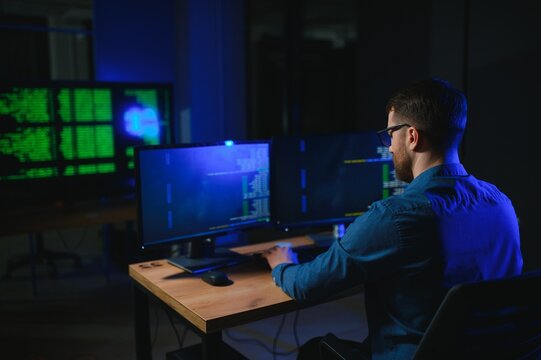 programmer working at desk in office