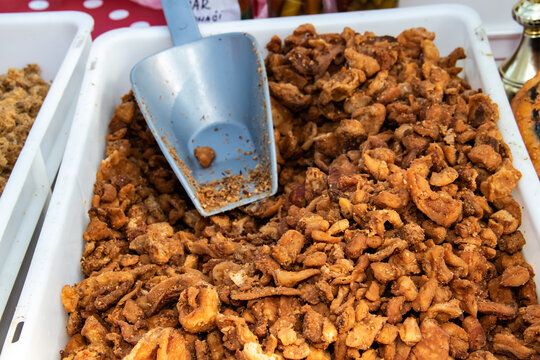 Homemade freshly picked pork greaves exposed for tasting and selling, in Serbia known as cvarci, made locally at country side