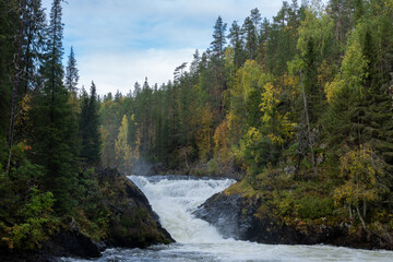 View to a powerful Jyrävä waterfall on a autumn day in Oulanka National Park, Northern Finland	