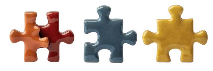 Three puzzle pieces in red, blue, and yellow, each with a unique texture, isolated on a transparent background.