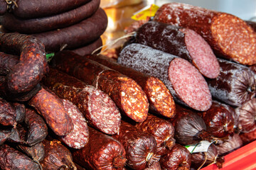 Serbian traditionally made and smoke dried sausages on a farmer's market in Kacarevo village, gastro bacon and dry meat products festival held yearly in Kacarevo, near Belgrade