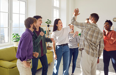 Young people diverse group, student community meeting, happy friends team giving high five greeting, ecxited about victory or accomplishment, showing recognition, express congratulations, support