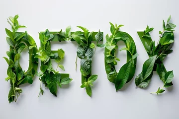 Fotobehang Detox word from fresh green leaves  on white background  © nnattalli