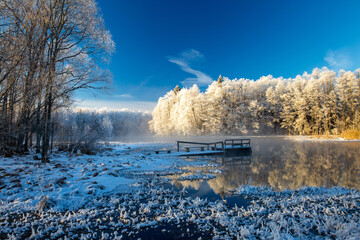 frosty sunrise at the spring water lake