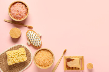 Composition with bath accessories and bowls with sea salt on pink background