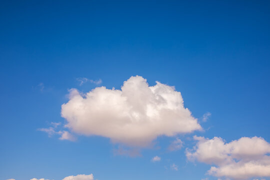 Portrait of a bright fluffy cloud at sky