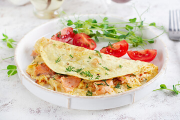 Healthy breakfast. Quesadilla with omelette, salmon  and sliced tomatoes. Keto, ketogenic lunch.