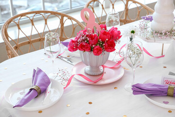 Elegant table setting with beautiful tulips for International Women's Day celebration
