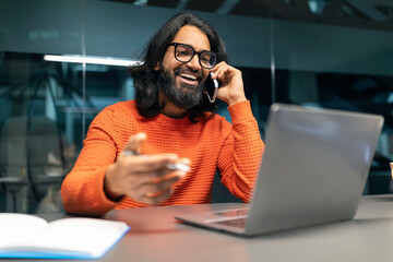 Indian man product manager working at modern office
