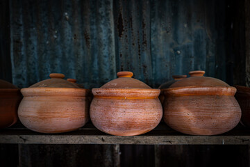 Row of Handcraft Claypots, Thai Earthware at Ko Kret island, Nonthaburi, Thailand.