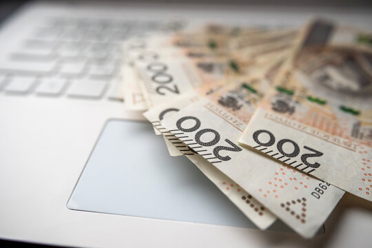Pln 200 zloty Polish money on laptop keyboard