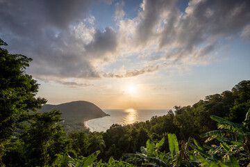 Guadeloupe, a Caribbean island in the French Antilles. Landscape and view of the Grande Anse bay on Basse-Terre. A secluded bay, lots of nature and mangroves, at sunrise.
