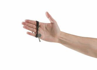 Referee holding whistle on white background, closeup