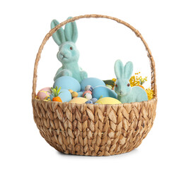 Wicker basket with painted Easter eggs and toy bunnies on white background