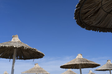Beach straw umbrellas