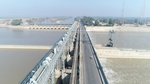 Aerial view of Head Taunsa Barrage is a barrage on the Indus River in Tehsil Taunsa, Dera Ghazi Khan District, Punjab Province, Pakistan. Where a lot of water is stored. Beautiful drone 4K view.