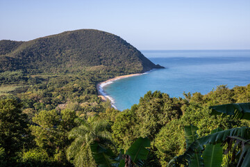 Guadeloupe, a Caribbean island in the French Antilles. View of the sandy beach of Guadeloupe. Caribbean vacation landscape. Grande Anse beach on the island of Basse-Terre. A secluded bay.