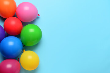 Fototapeta na wymiar Colorful festive balloons on blue background