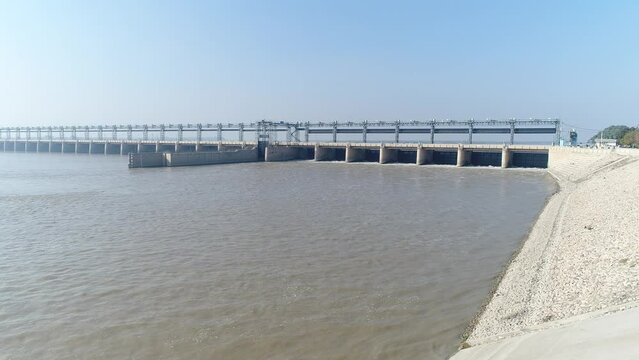 Aerial view of Head Taunsa Barrage is a barrage on the Indus River in Tehsil Taunsa, Dera Ghazi Khan District, Punjab Province, Pakistan. Where a lot of water is stored. Beautiful drone 4K view.
