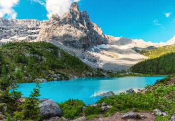 Panoramic view of Sorapis lake in Dolomites mountain, Italian Alps, Belluno, Italy. Alpine Lago di Sorapis with turquoise water near Cortina dAmpezzo. Summer vacation destination