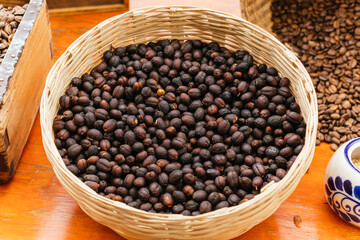 Coffee beans ready to be cleaned and roasted in a basket.