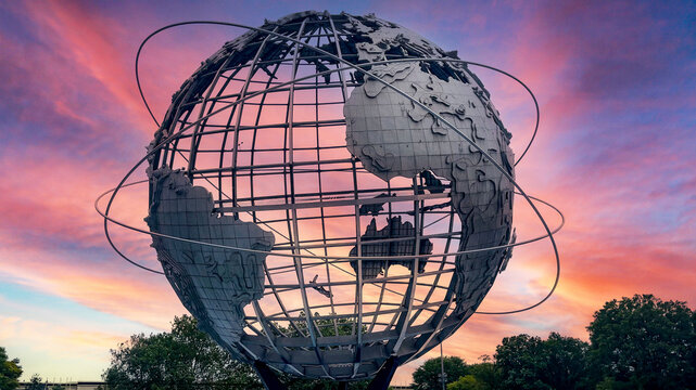New York, USA; January 4, 2024: The unisphere of the well-known Flushing Meadows-Corona Park in the borough of Queens with the orange sky of a sunrise