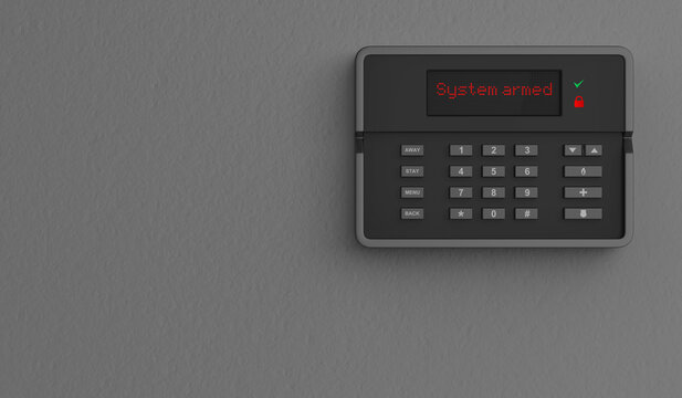 Home security alarm system on grey wall