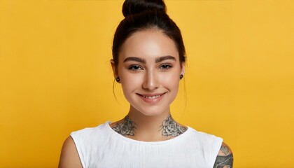 Young Smiling pretty girl beauty female gen z model beautiful face healthy skin and tattoo looking at camera wearing white top isolated at dark yellow background