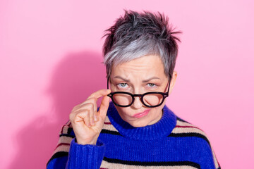 Portrait of strict funny woman wear striped pullover fingers touch glasses suspiciously look at you...