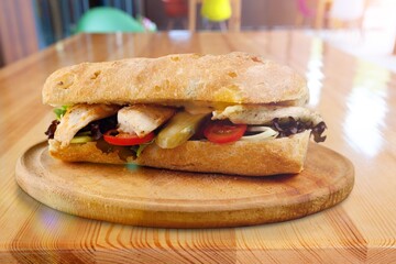Tasty fresh sandwich with herbs on the desk