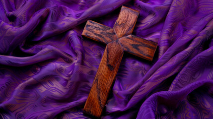 Ash Wednesday theme with a detailed wooden cross on purple fabric highlighting the days religious...