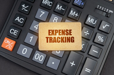 There is a sign on the calculator that says - Expense tracking