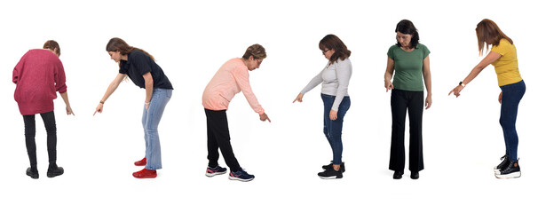 group of women pointing down on white background © Curto