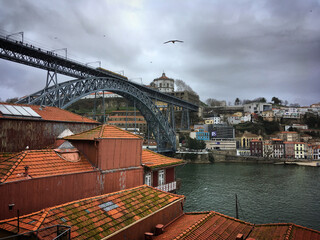 Naklejka premium Dom Luís I Bridge over the river Douro and old houses of Ribeira neighborhood, Porto, Portugal, January 2018