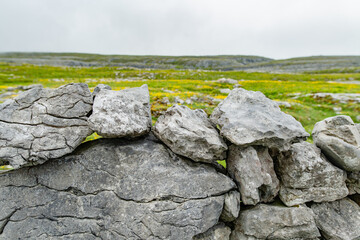 Irish dry-stone wall, built with a variety of stones to separate and protect crop fields as well as...