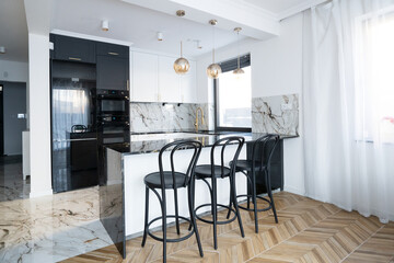 white and black modern kitchen room with bar counter