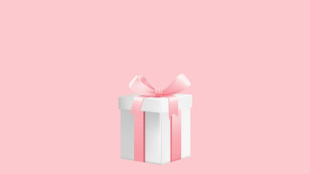 White gift box with pink ribbon.. Holidays and gifts concept.