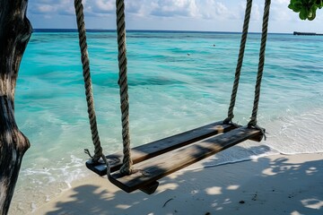 a scenic view of a swing over a beautiful beach and sea