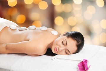 Obraz na płótnie Canvas Woman enjoying body massage at spa salon.