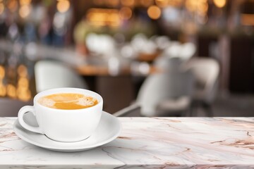 Wooden table at coffee shop  with a cup