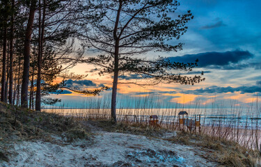 Winter coastal landscape in Jurmala – famous Latvian tourist resort on the Baltic Sea. Beautiful sand beaches cover more than 26 km of coastline of the Riga gulf - 740261761