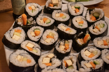 Fresh Homemade Sushi Roll against old wooden table.
